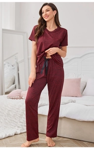 Detail of burgundy lounge set featuring V-neck short sleeve top and bow-tie waist pants
