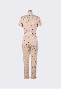 Detail of heart print loungewear set featuring ribbed fabric and lettuce edge hems
