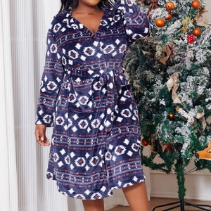 Navy blue flannel hooded robe with white geometric pattern and red lines in cozy festive setting