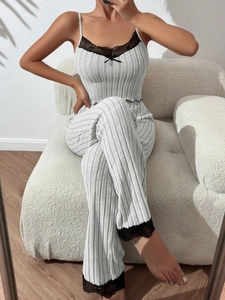 Detail of grey ribbed loungewear set with black lace trim and delicate bow accent