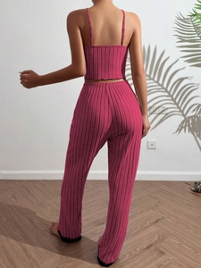 Detail of magenta ribbed knit two-piece lounge set with cropped camisole and high waist pants