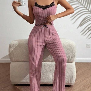Pink ribbed loungewear set with lace trim and bow detail including top and pants