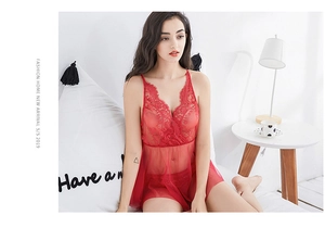 Detail of red lace babydoll sleepwear featuring sheer mesh and intricate V-neck embroidery