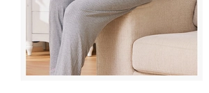 Detailed macro view of grey ribbed texture fabric on casual long lounge pants for women