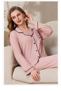 Detail of pink ribbed pajama set with black contrast trim and chest pocket detail