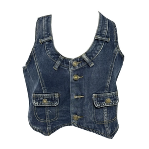 Detailed close-up of a vintage washed blue denim vest with U-neck and metal buttons