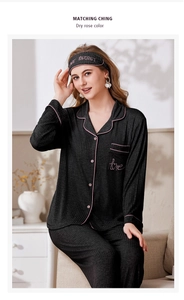 Detail of soft ribbed pajama set featuring pink piping and love embroidery on pocket
