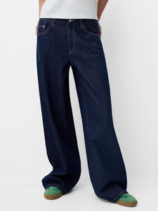 Jean vintage femme bleu foncé à jambes larges avec surpiqûres et coupe décontractée