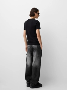 Back view of men's loose fit straight wide leg jeans with grey washed vintage denim finish