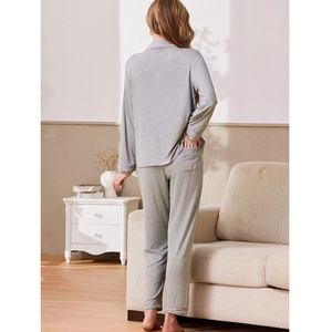 Women's grey ribbed knit pajama set with long sleeves and pink contrast trim detailing