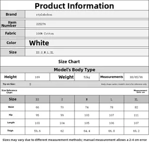 Size chart for white wide-leg distressed jeans with model measurements and garment dimensions