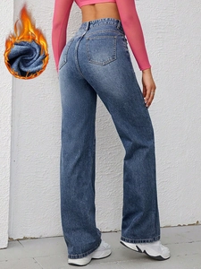 Detail view of high waist wide leg jeans with warm fleece lining and classic back pockets