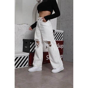 White high waisted wide leg distressed jeans with knee rips in street fashion style