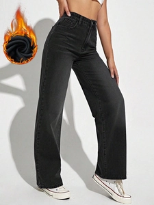 Close-up of black high-waisted wide-leg fleece jeans with soft warm thermal lining