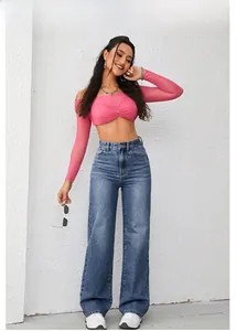 Pink long sleeve mesh crop top with front twist knot and high waist wide leg blue jeans