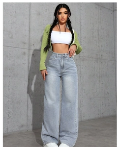 Detail of high-waisted light blue wide-leg denim jeans with a classic five-pocket design