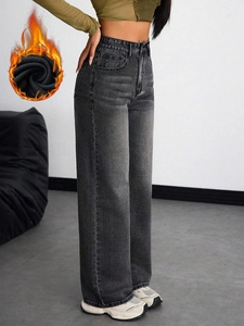 Detail of women's high waisted wide leg jeans with warm fleece lining in charcoal grey