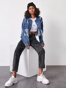 Detail of blue distressed denim jacket with fringe and ripped texture for women