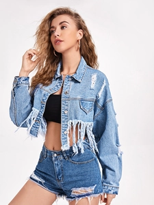 Detail shot of light blue distressed denim jacket featuring long fringe and frayed edges