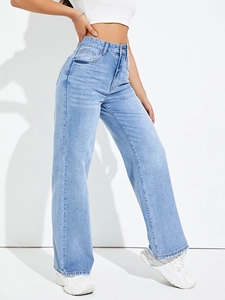 Detailed view of light blue high-waisted wide-leg jeans with retro washed denim texture