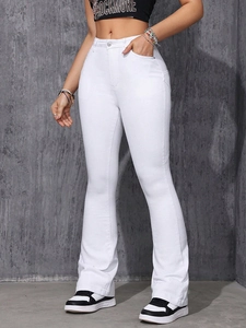 Close-up of white high-waisted flare jeans featuring slim fit and classic button zip fly