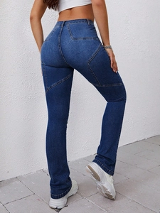 Detail view of high waist dark blue flare jeans with unique star stitching on the back