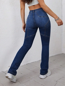 Detailed back view of high waist denim jeans with unique star stitching design
