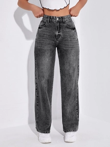 Detail shot of the vintage smoky grey wash texture and denim fabric on straight jeans