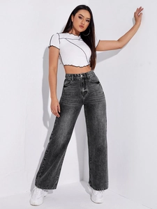 Detail of high waist wide leg jeans in dark grey wash with contrast stitch crop top