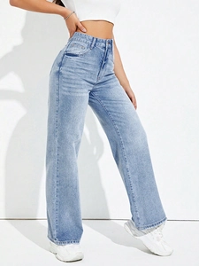 Detail of high waisted wide leg jeans in light blue wash showing side silhouette and fit