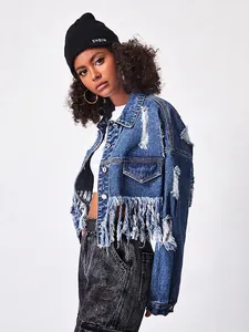 Short cropped blue denim jacket with fringe hem and distressed detailing in street style