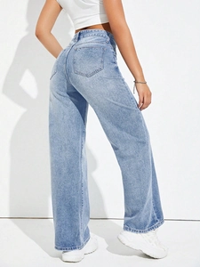 Detail view of high-waisted light blue wide-leg denim pants showing back pockets and stitching