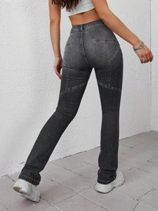 Detail of star-shaped stitching and patchwork on high-waist grey flared denim jeans