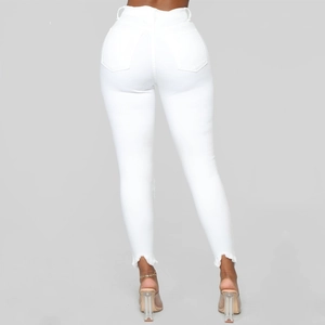 Detailed back view of white high-waisted skinny jeans with frayed hems and dual pockets