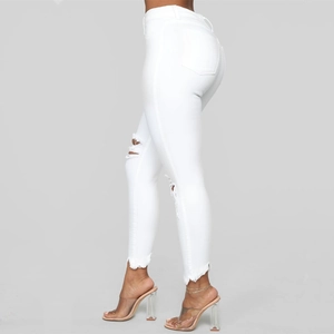 Women's white high waist skinny ripped jeans with distressed hem and slim fit design
