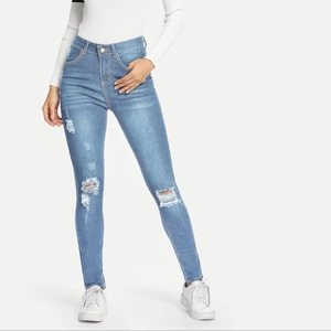 Women's light blue ripped skinny jeans with high waist and distressed denim finish