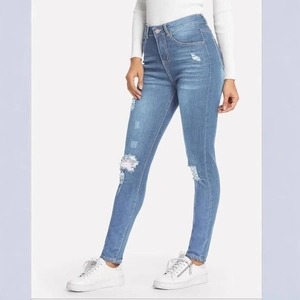 Slim fit light blue distressed high waisted denim jeans for women in casual style