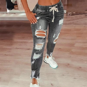 Women's slim fit grey ripped jeans with elastic drawstring waist and frayed hems
