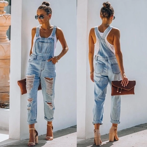 Front and back view of light blue distressed denim overalls with ripped details