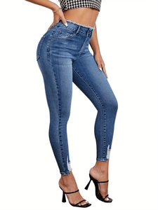 Women's high waist skinny ripped denim jeans with frayed hems and slim fit silhouette