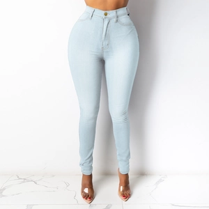 Detailed view of high waist skinny blue denim jeans showing button closure and pockets