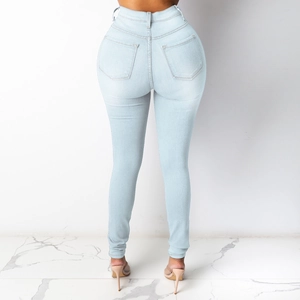 Rear view of light blue high-waisted skinny jeans showing stretch fit and back pocket detail