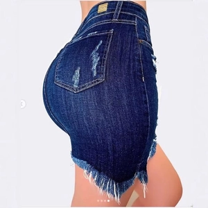 High-waisted distressed denim mini skirt with ripped details and frayed hemline