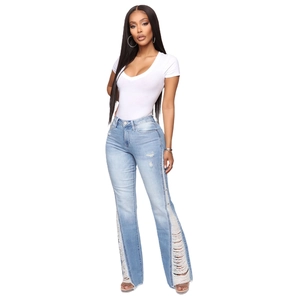 Women's light blue flared jeans with side cutout rips and white v-neck t-shirt ensemble