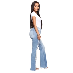 Women's light blue high waist flare jeans with side fringe distressed details and white t-shirt