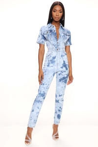Close-up of blue and white tie-dye denim jumpsuit with metal buttons and collar