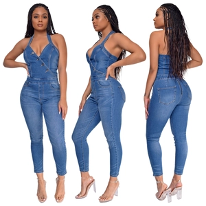 Slim fit dark blue denim halter jumpsuit with V-neck and metal zipper back detail