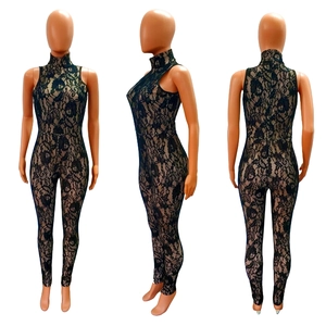 Close-up of the intricate black floral lace texture and embroidery on this bodysuit