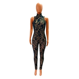 Detailed view of black floral lace fabric on a sleeveless high-neck slim fit jumpsuit