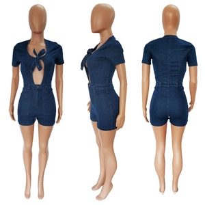 Detailed views of a dark blue denim romper featuring cut-out waist and bow tie detail